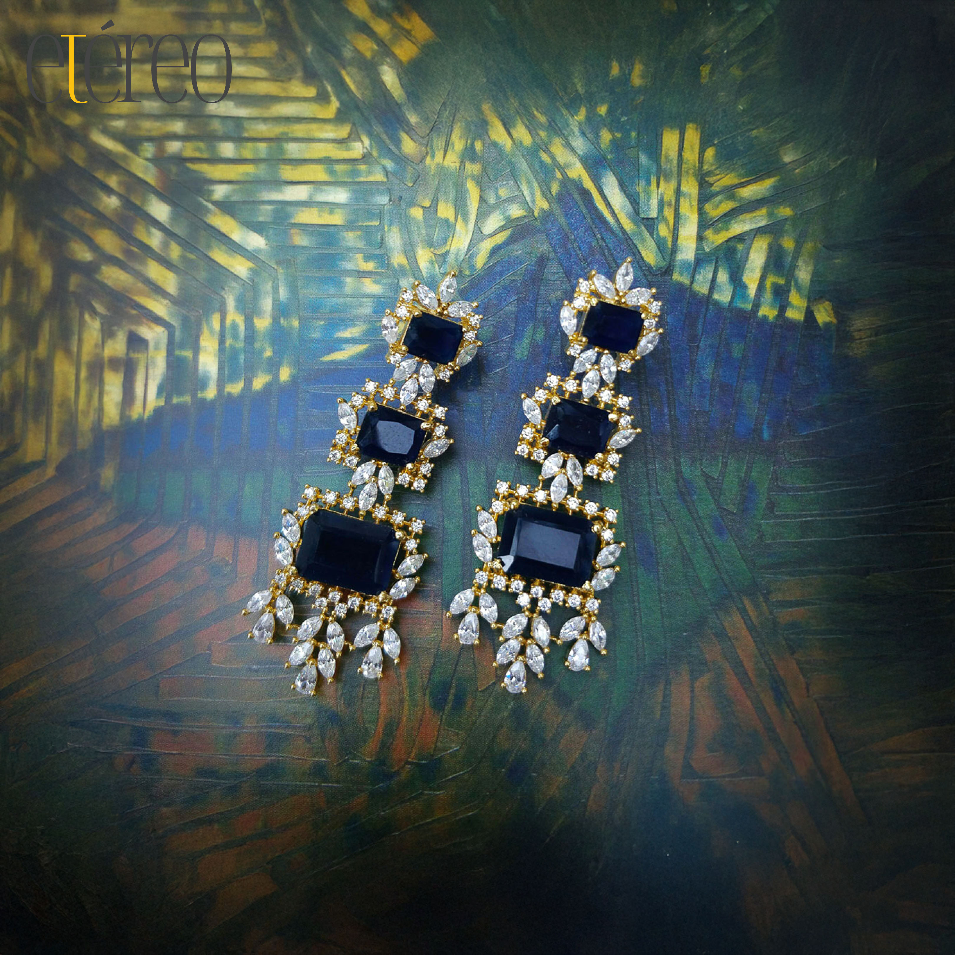 ER12MI138-Three dark blue rectangular gemstones surrounded by zircons